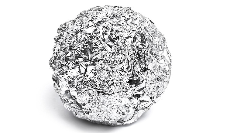 a crumbled ball of aluminum foil