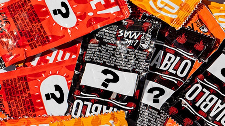 Taco Bell packets with question marks for phrases