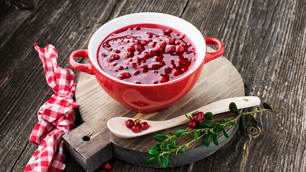 Lingonberry sauce in bowl on table