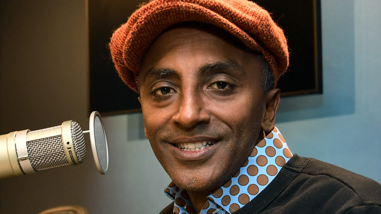 Marcus Samuelsson smiling near radio microphone