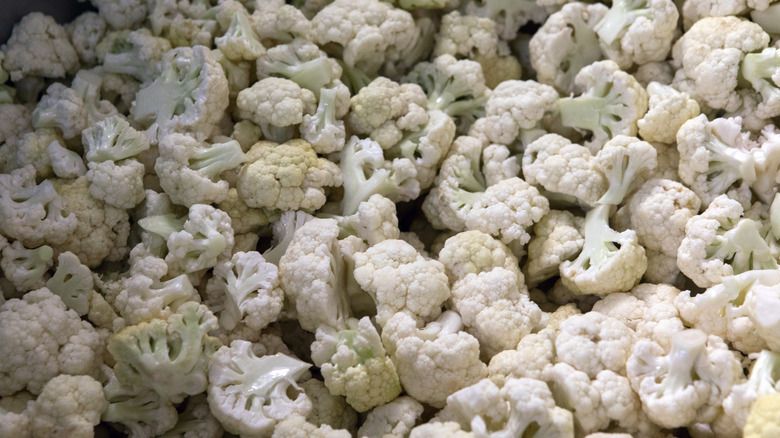 Broken up cauliflower being washed