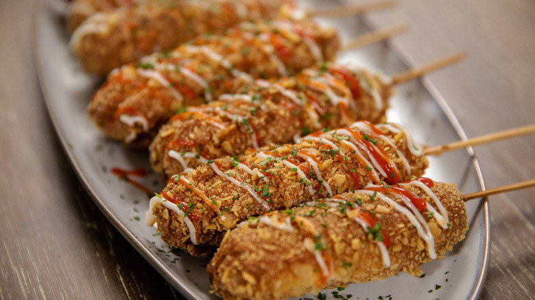 Carla Hall's Tostitos crusted corn dogs on plate