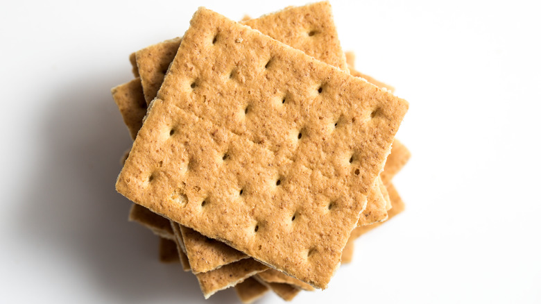 Graham crackers stacked against white background