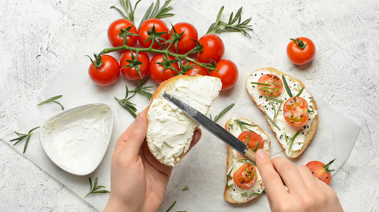 creamy spread on toast with tomatoes