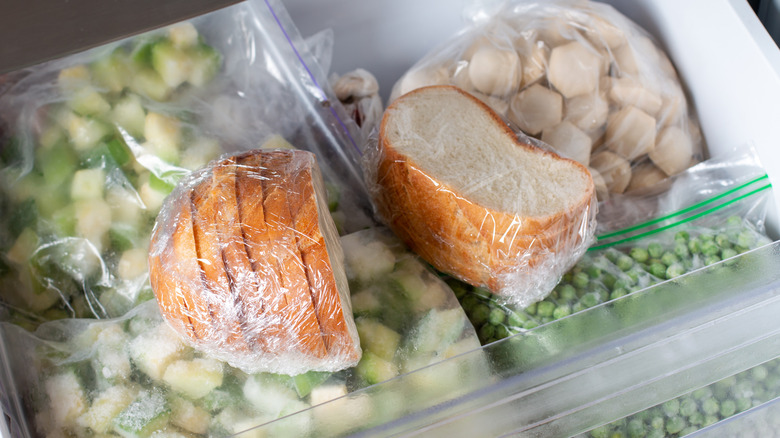 Frozen bread and vegetables in a freezer