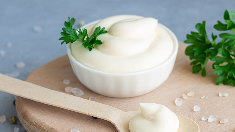 Mayonnaise in white bowl with garnish