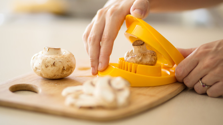 yellow egg slicer cutting mushrooms