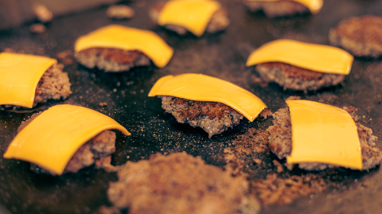 cheeseburgers on a grill