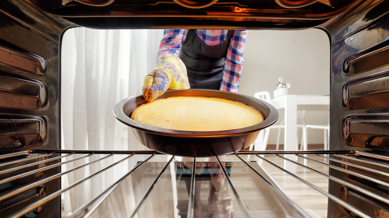 Placing cake pan in oven