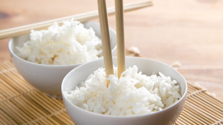 Chopsticks upright in rice