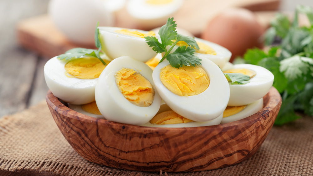 Hard boiled eggs in a wooden bowl