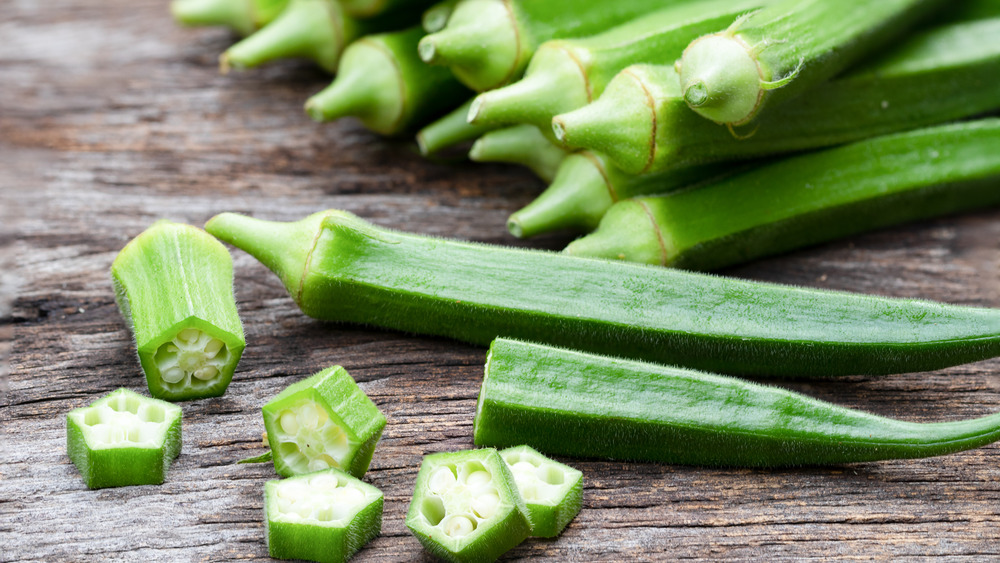 Sliced okra on wooden table