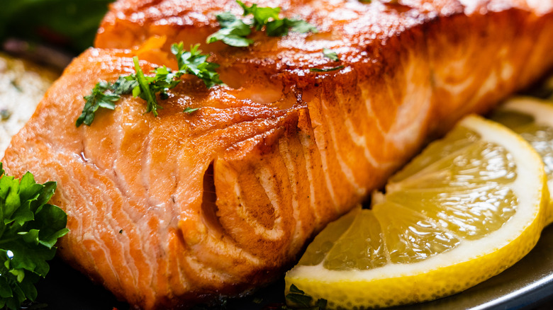 Cooked salmon with lemon and herbs