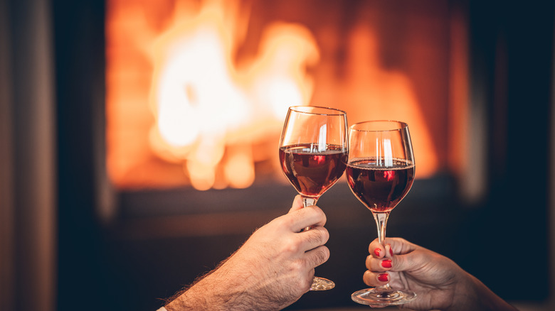 Wine glasses in front of a freplace