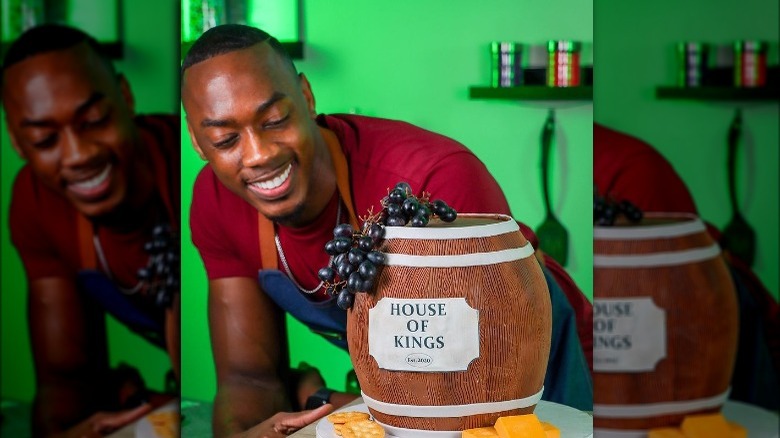 Robert Lucas with his wine barrel cake