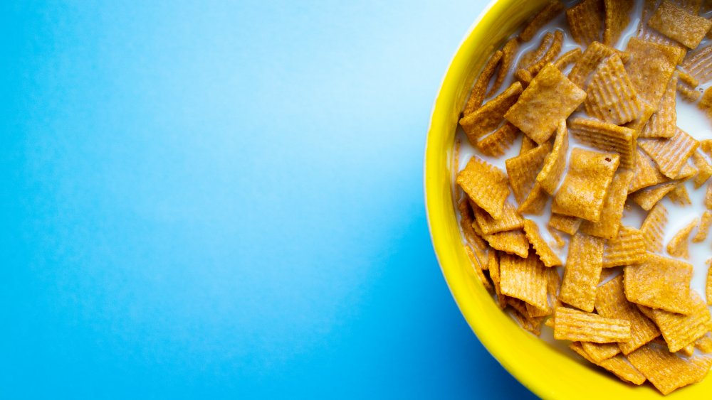 cereal in a yellow bowl against a blue background