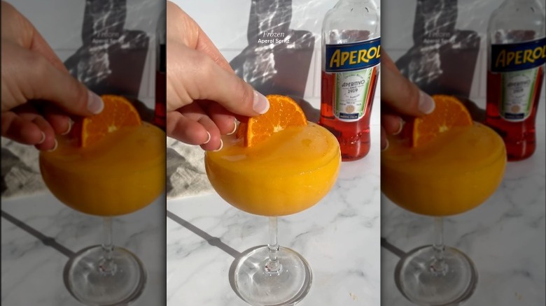 Frozen Aperol spritz with orange garnish