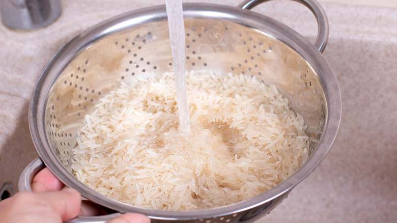 washing rice in colander