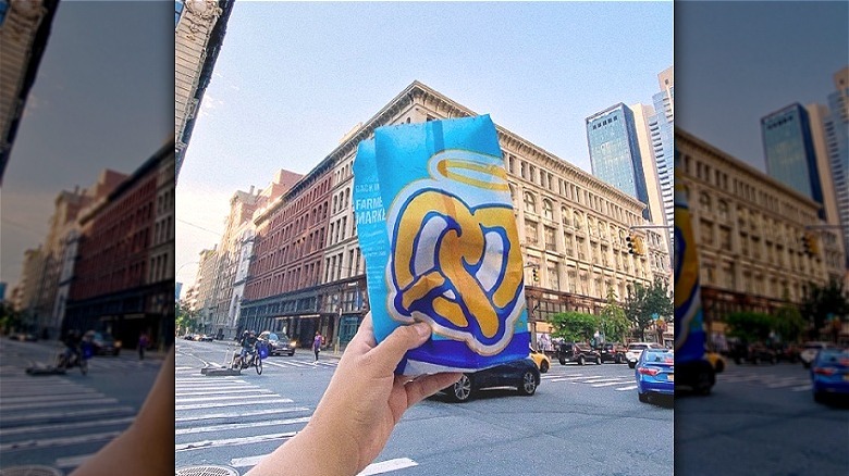 Person holding fast food bag