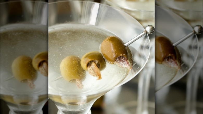 Dirty martini with anchovy stuffed olives