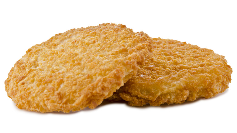 two breaded chicken patties