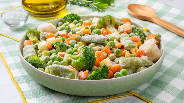 Frozen vegetables in green bowl