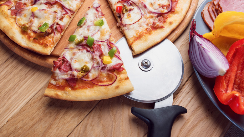slicer and pizza