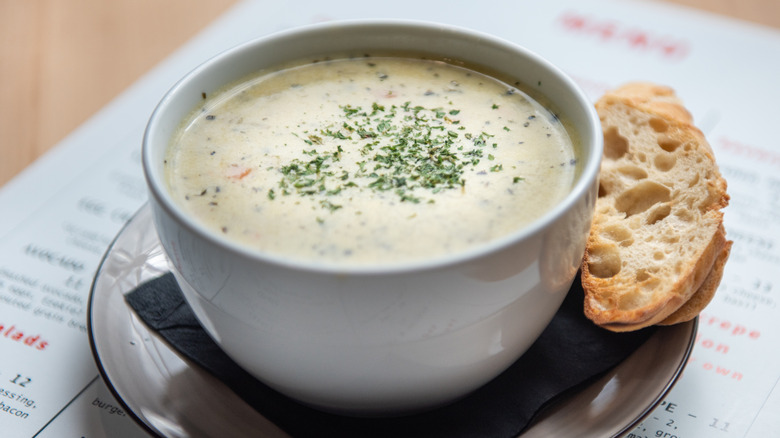 Creamy potato soup with piece of toasted bread