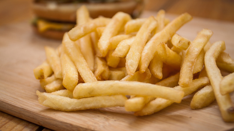 French fries on wooden table