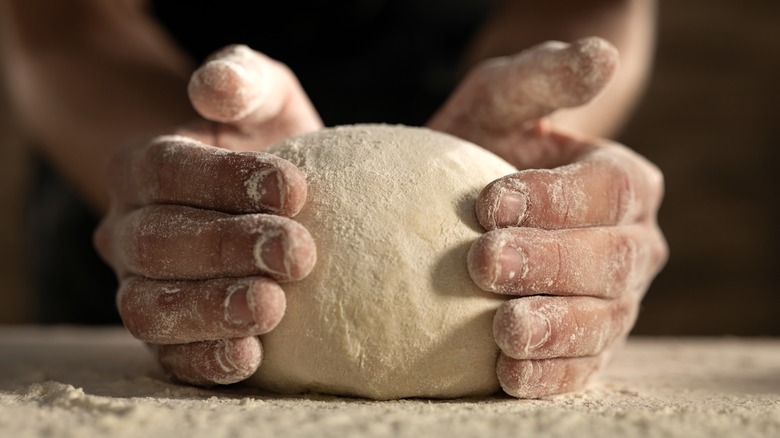 Person kneading dough 