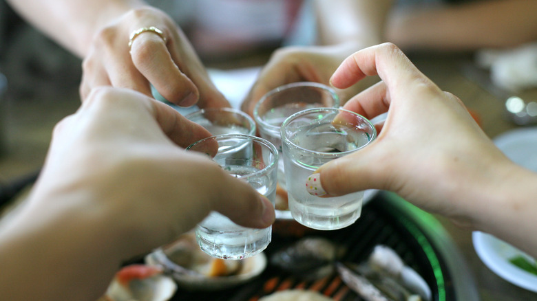 Cheering soju shots with friends