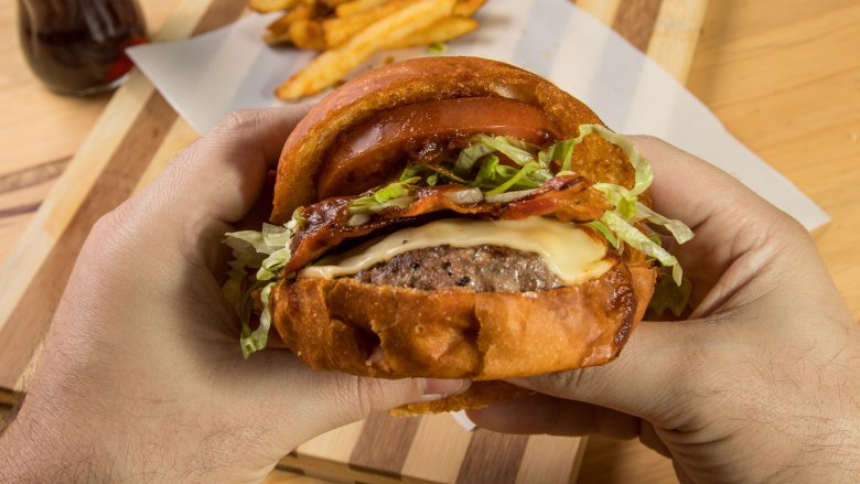 man holding a burger