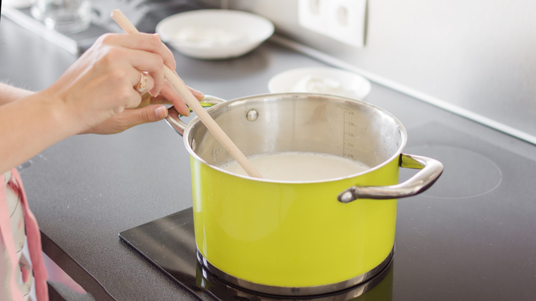 stirring cream in pot