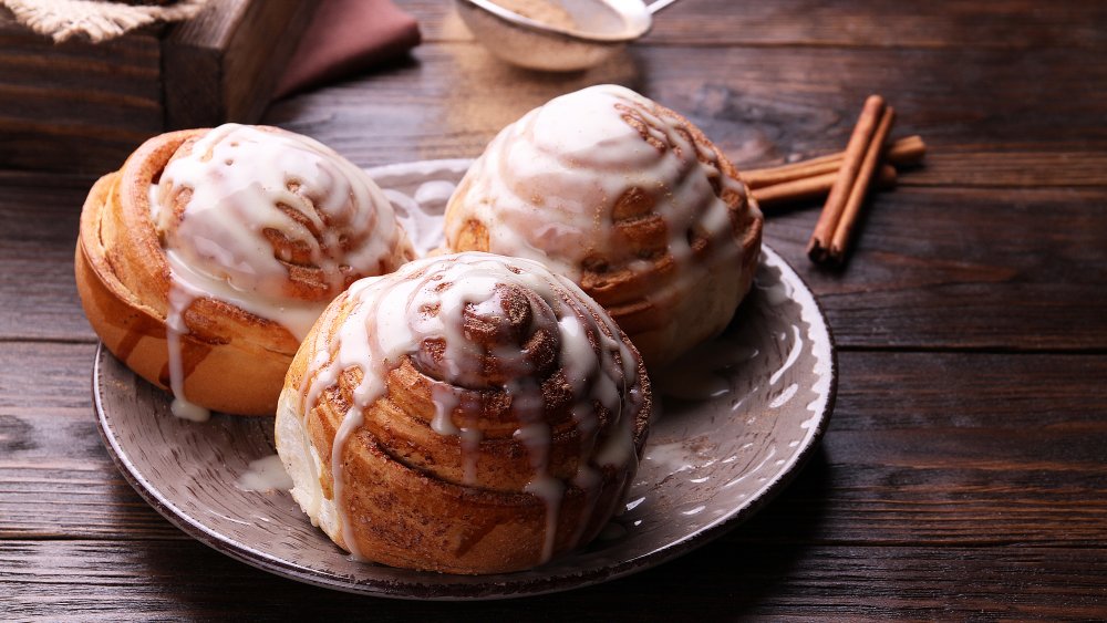 cinnamon rolls with icing on the tops