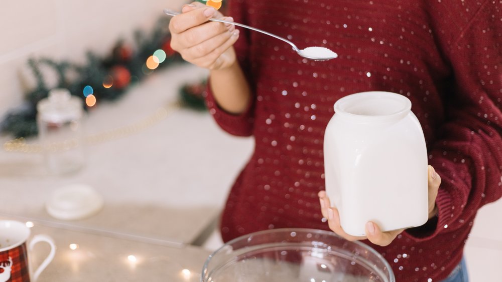 Measuring flour with spoon