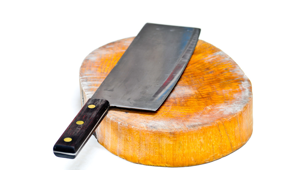 Chinese cleaver and wooden chopping board