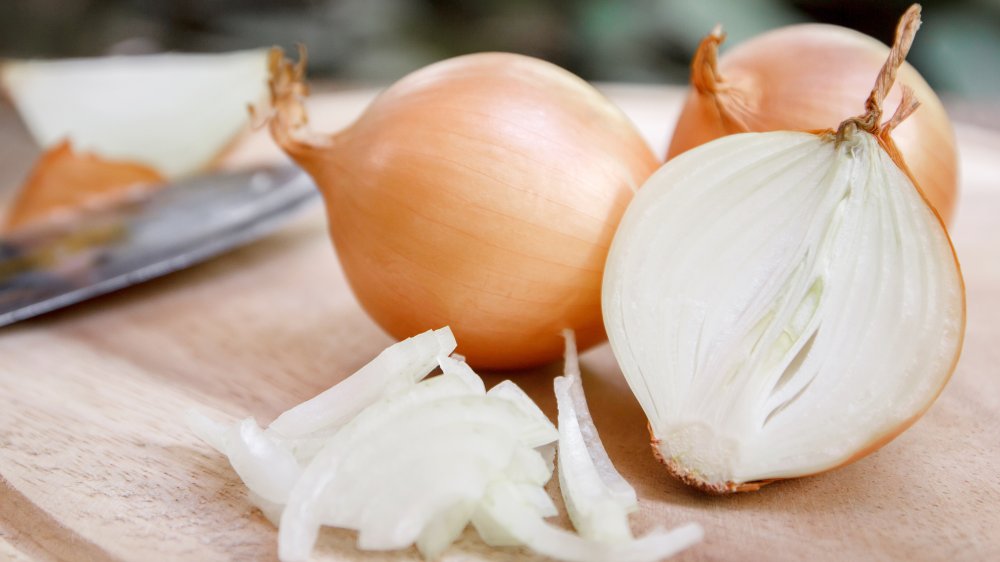 Sliced and whole yellow onions