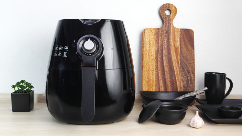 An air fryer on a kitchen counter