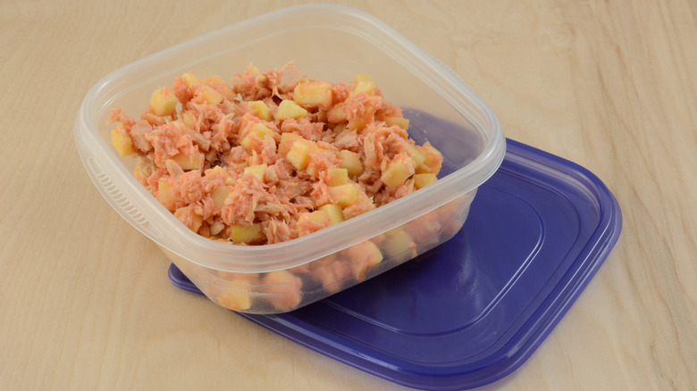 Tuna salad in plastic Tupperware container