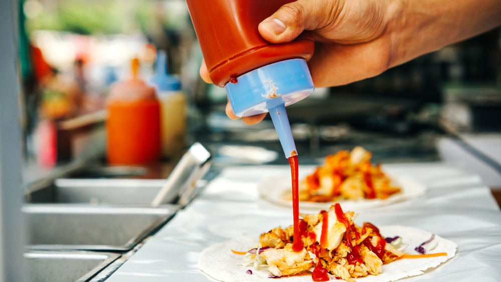 Ketchup poured onto chicken