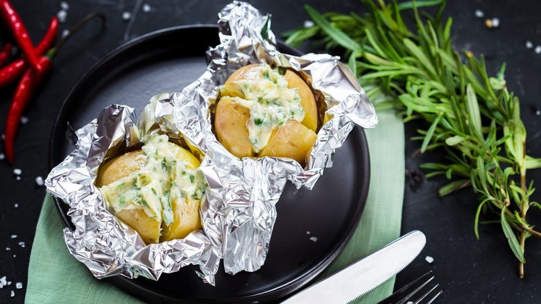 baked potatoes wrapped in foil