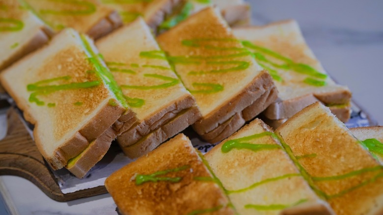 Green coconut jam on an assortment of toast