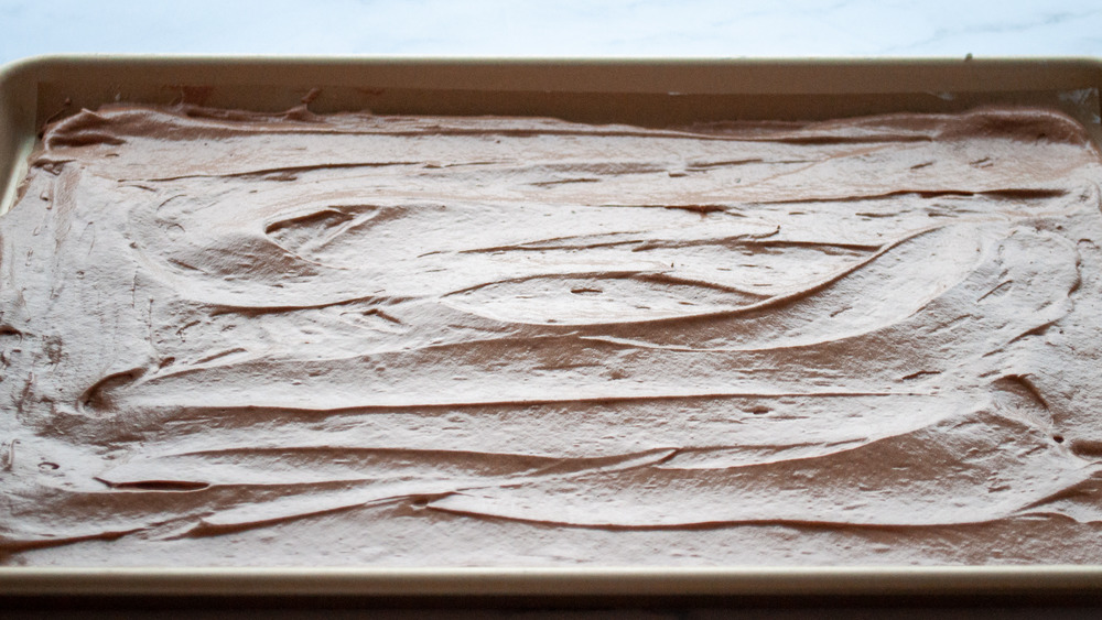 yule log batter on baking sheet